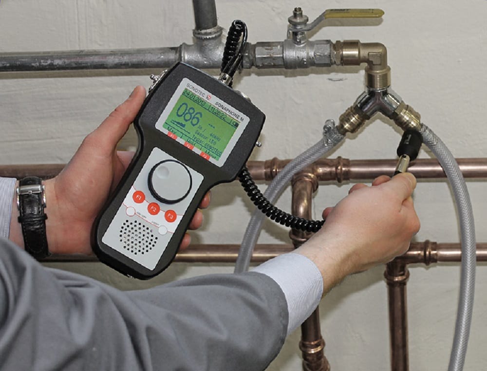 Plumber testing pipes with electronic leak detection equipment in Port Charlotte